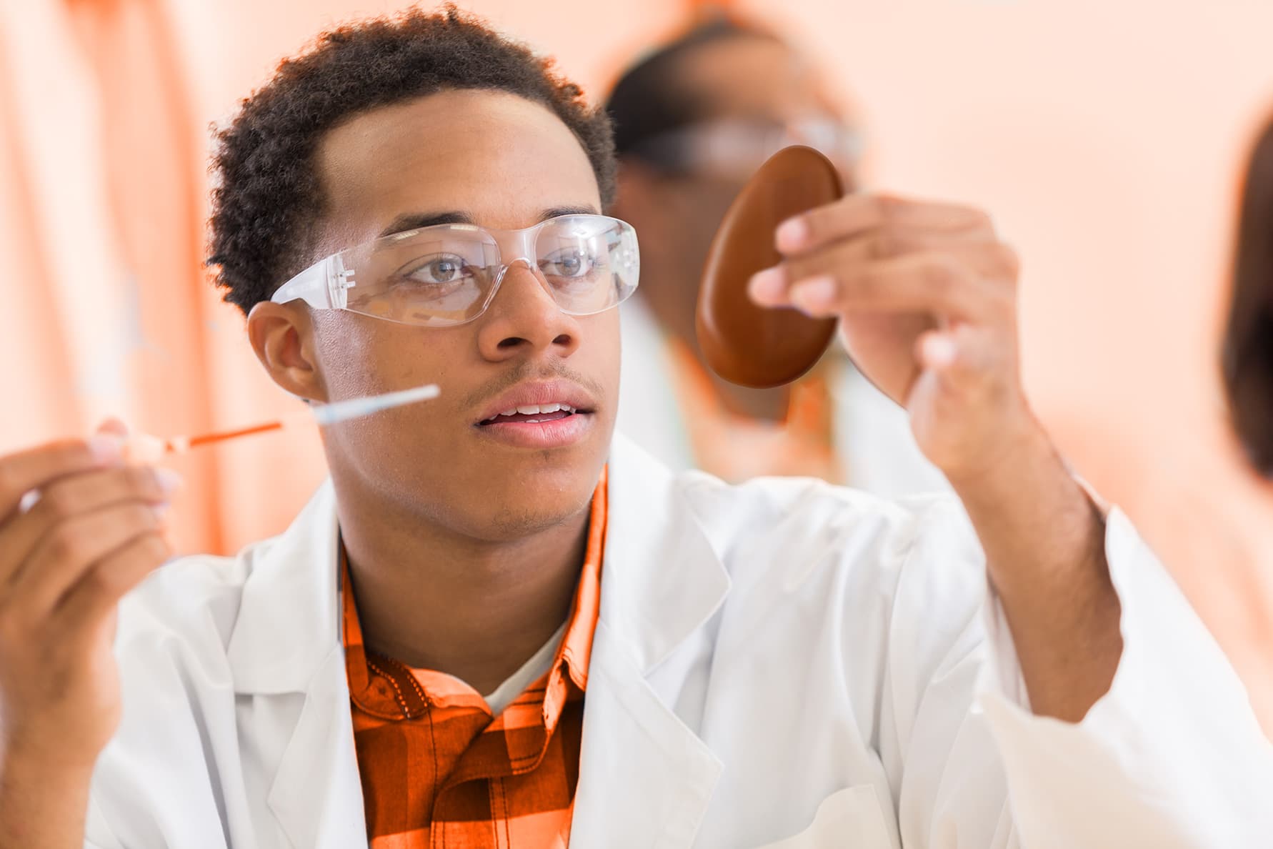 student in lab coat