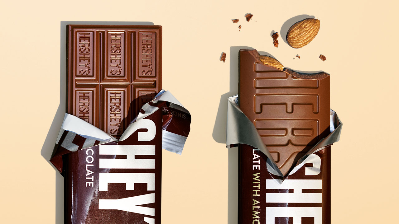 partially unwrapped hersheys chocolate and hersheys almond chocolate candy bars